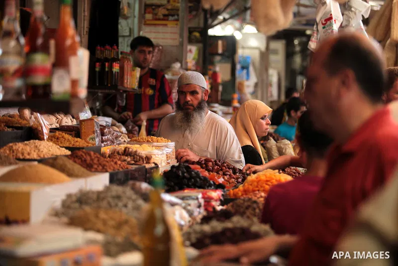 A Palestinian man sells spices in her shop at a market in Gaza City, as Muslims prepare for the upcoming holy fasting month of Ramadan, on June 28, 2014. on the eve of the start of the Muslim holy month of Ramadan. Durin...