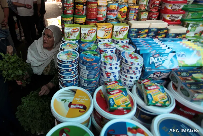 A Palestinian man sells foods in her shop at a market in Gaza City, as Muslims prepare for the upcoming holy fasting month of Ramadan, on June 28, 2014. on the eve of the start of the Muslim holy month of Ramadan. During...