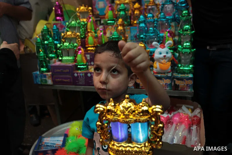 A Palestinian boy carries a traditional Ramadan lantern at a market in Gaza City, as Muslims prepare for the upcoming holy fasting month of Ramadan, on June 28, 2014. on the eve of the start of the Muslim holy month of R...