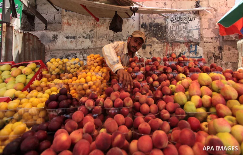 A Palestinian man sells fruits in her shop at a market in Gaza City, as Muslims prepare for the upcoming holy fasting month of Ramadan, on June 28, 2014. on the eve of the start of the Muslim holy month of Ramadan. Durin...