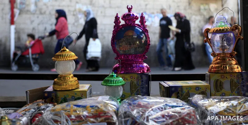 A Palestinian man sells a traditional Ramadan lantern in his shop at a market in the West Bank City of Ramallah, as Muslims prepare for the upcoming holy fasting month of Ramadan, on June 28, 2014. on the eve of the star...