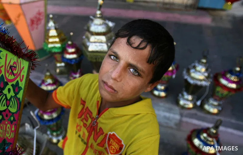 A Palestinian boy carries a traditional Ramadan lantern in Rafah in the southern of Gaza City, as Muslims prepare for the upcoming holy fasting month of Ramadan, on June 28, 2014. on the eve of the start of the Muslim ho...