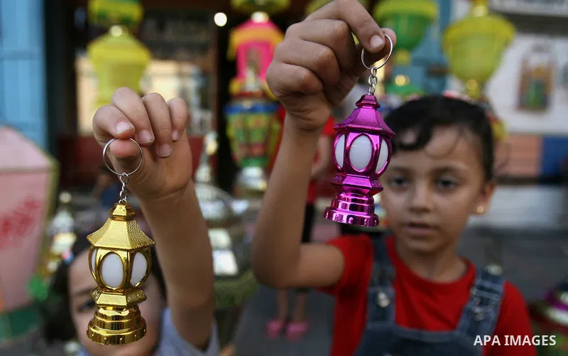 Palestinian children carry a traditional Ramadan lantern in Rafah in the southern of Gaza City, as Muslims prepare for the upcoming holy fasting month of Ramadan, on June 28, 2014. on the eve of the start of the Muslim h...