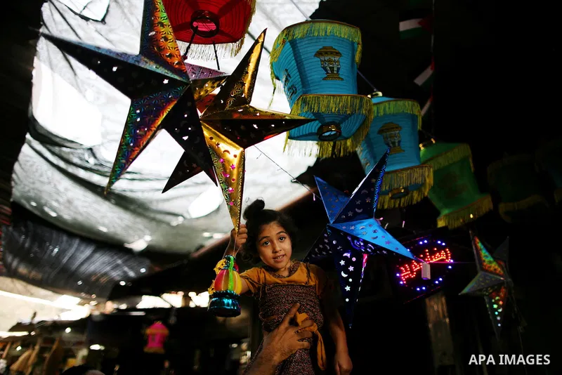 A Palestinian man sells a traditional Ramadan lantern in his shop at a market in Gaza City, as Muslims prepare for the upcoming holy fasting month of Ramadan, on June 28, 2014. on the eve of the start of the Muslim holy...