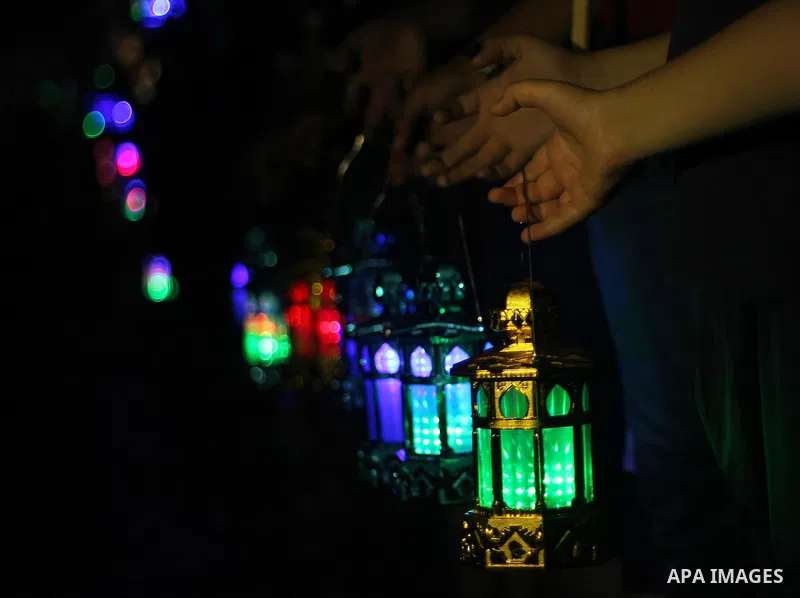Palestinians children hold Ramadan lanterns during a night vigil in Gaza City, calling for international attention to the deteriorating economic situation in the territory. Saturday, June 28, 2014. Ramadan falls this yea...