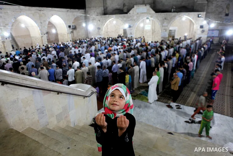 Palestinian Muslims pray al-Taraweeh prayer at al-Omari Mosque in Gaza city on June 28, 2014. Muslim believers abstain from eating, drinking, smoking and having sex from dawn until sunset. Ramadan is sacred to Muslims be...
