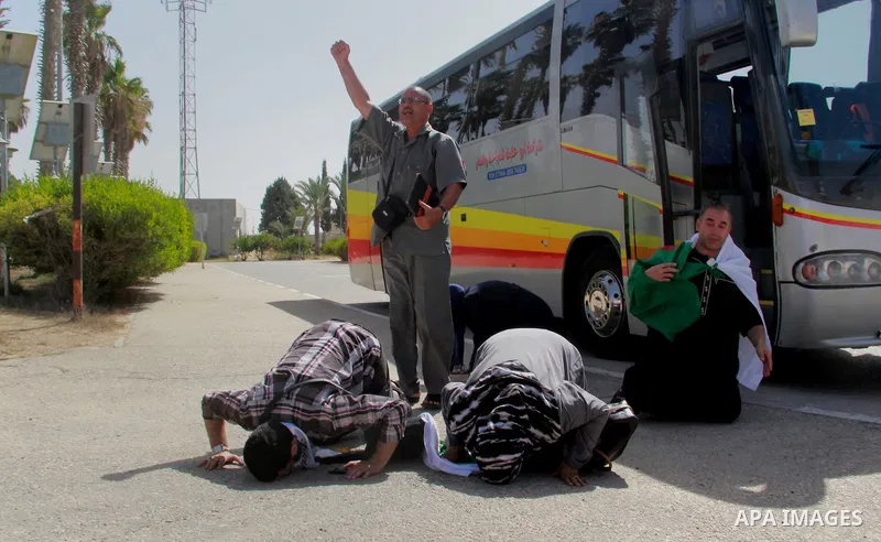 Members of the aid convoy of "Miles of Smiles 28" convoy at Rafah crossing border in southern Gaza Strip, June 29, 2014. Photo by Eyad Al Baba