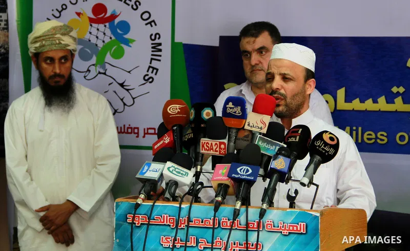 Members of the aid convoy of "Miles of Smiles 28" hold a press conference upon their arrival at the Rafah crossing border, in the southern Gaza Strip, June 29, 2014. Photo by Eyad Al Baba