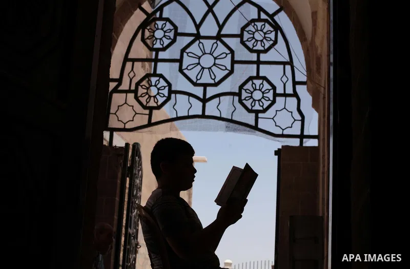 A Palestinian muslim reads the holy Qur'an at mosque in Gaza city, on June 30, 2014. Muslims around the world refrain from eating, drinking and sexual intercourse from dawn till dusk during Ramadan, the holiest month in...