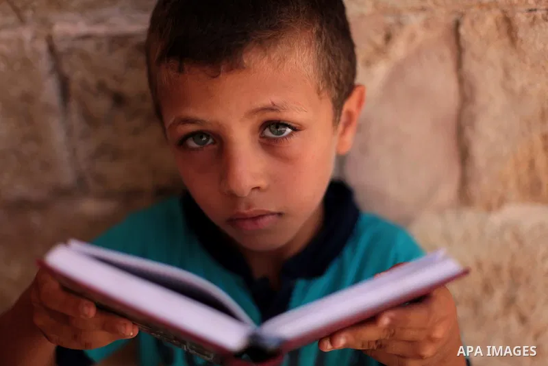 A Palestinian muslim reads the holy Qur'an at mosque in Gaza city, on June 30, 2014. Muslims around the world refrain from eating, drinking and sexual intercourse from dawn till dusk during Ramadan, the holiest month in...