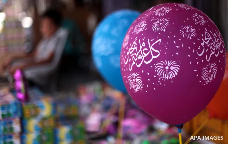 A Palestinian man sells balloons Ramadan in his shop at a market in Gaza city, on June 30, 2014. Muslims around the world refrain from eating, drinking and sexual intercourse from dawn till dusk during Ramadan, the holie...