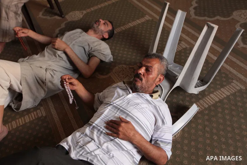 Palestinian muslims sleep at mosque during the Muslims fasting month of Ramadan in Gaza city, on June 30, 2014. Muslims around the world refrain from eating, drinking and sexual intercourse from dawn till dusk during Ram...