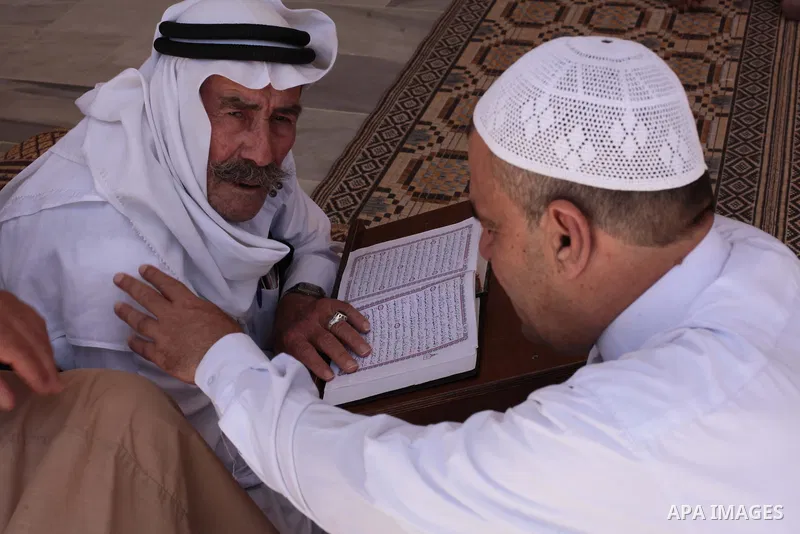 Palestinian muslims read the holy Qur'an at mosque in Gaza city, on June 30, 2014. Muslims around the world refrain from eating, drinking and sexual intercourse from dawn till dusk during Ramadan, the holiest month in th...