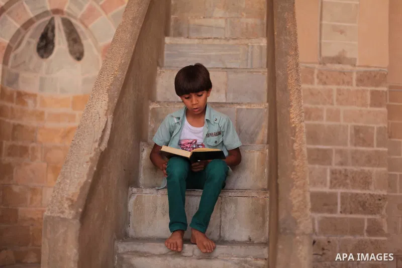 A Palestinian muslim reads the holy Qur'an at mosque in Gaza city, on June 30, 2014. Muslims around the world refrain from eating, drinking and sexual intercourse from dawn till dusk during Ramadan, the holiest month in...