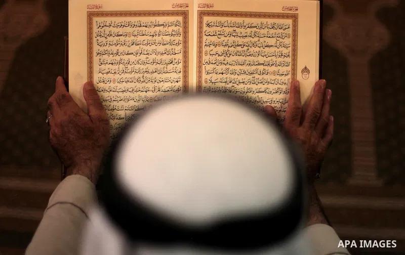 A Palestinian muslim reads the holy Qur'an at mosque in Gaza city, on June 30, 2014. Muslims around the world refrain from eating, drinking and sexual intercourse from dawn till dusk during Ramadan, the holiest month in...
