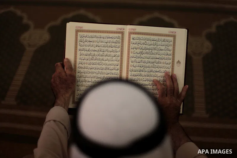 A Palestinian muslim reads the holy Qur'an at mosque in Gaza city, on June 30, 2014. Muslims around the world refrain from eating, drinking and sexual intercourse from dawn till dusk during Ramadan, the holiest month in...