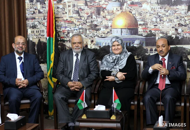 Palestinian ministers of unity government in Gaza Strip meet with the aid convoy of "Miles of Smiles" in Gaza city June 30, 2014. Photo by Mohammed Asad