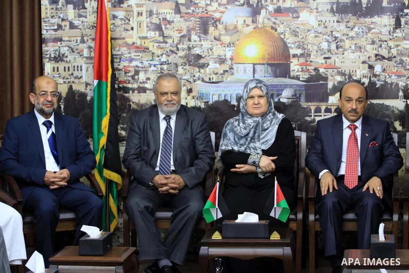 Palestinian ministers of unity government in Gaza Strip meet with the aid convoy of "Miles of Smiles" in Gaza city June 30, 2014. Photo by Mohammed Asad