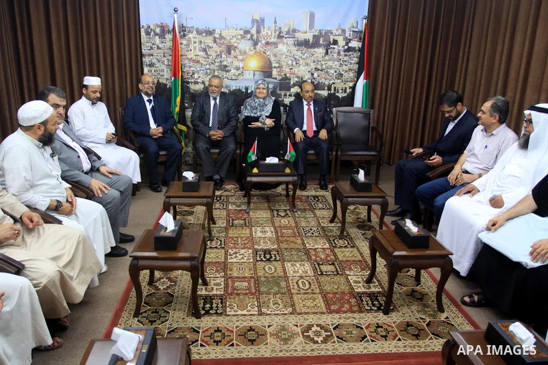 Palestinian ministers of unity government in Gaza Strip meet with the aid convoy of "Miles of Smiles" in Gaza city June 30, 2014. Photo by Mohammed Asad