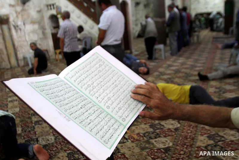 A Palestinian muslim reads the holy Qur'an at mosque, during the holy month of Ramadan in West Bank City of Nablus, on June 30, 2014. Muslims around the world refrain from eating, drinking and sexual intercourse from daw...