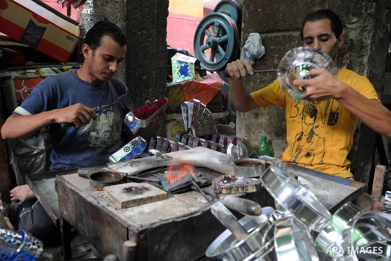 Egyptian men make traditional lanterns used for the holy month of Ramadan at a market in Cairo, Egypt, July 01, 2014. Muslim believers abstain from eating, drinking, smoking and having sex from dawn until sunset. Ramadan...