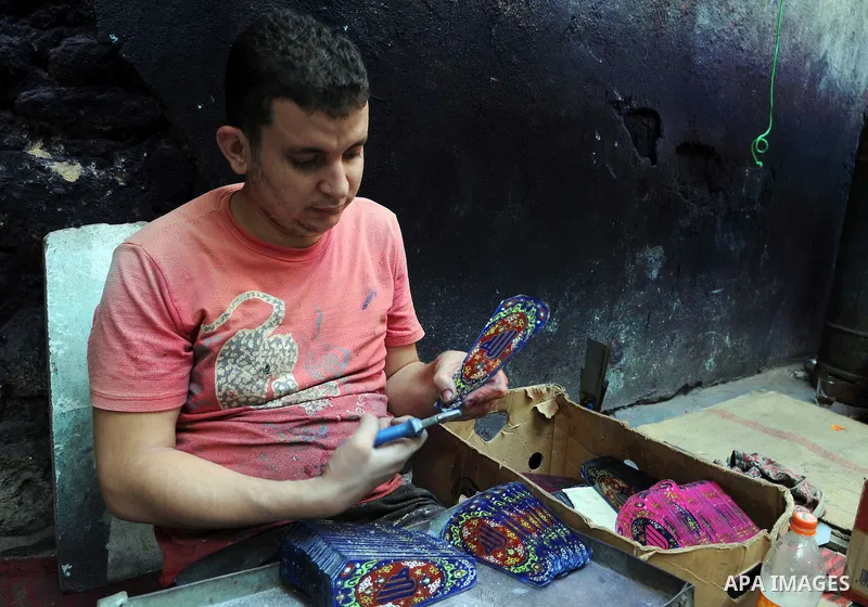 An Egyptian man makes traditional lanterns used for the holy month of Ramadan at a market in Cairo, Egypt, July 01, 2014. Muslim believers abstain from eating, drinking, smoking and having sex from dawn until sunset. Ram...