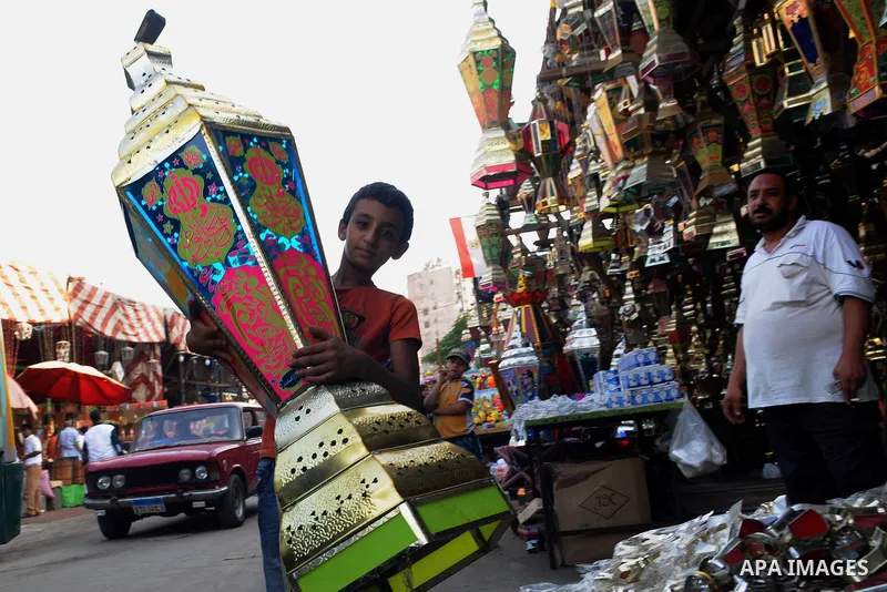 An Egyptian boy sells traditional lanterns used for the holy month of Ramadan at a market in Cairo, Egypt, July 01, 2014. Muslim believers abstain from eating, drinking, smoking and having sex from dawn until sunset. Ram...
