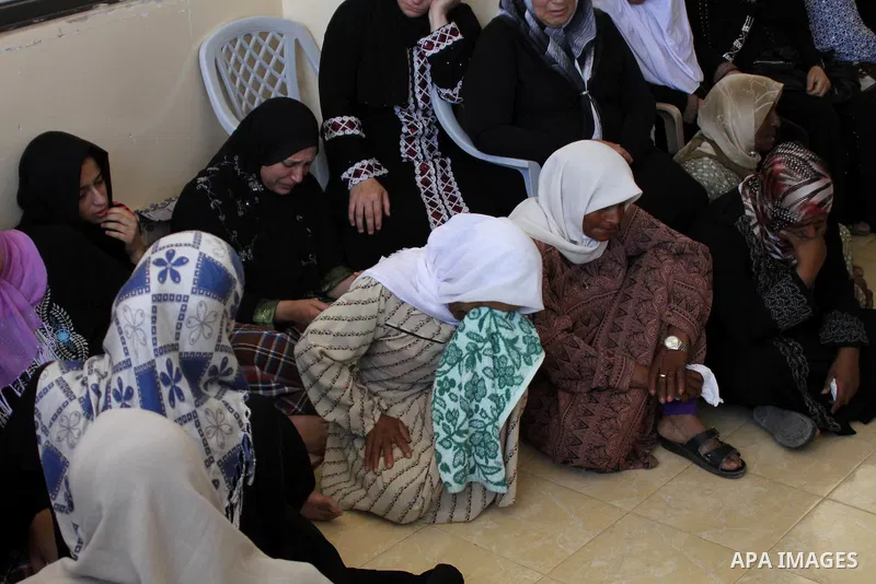Relatives of Palestinian youth Yousef Abu Zagha, 20, mourn during his funeral at the morgue of the Jenin refugee camp, in Jenin, West Bank, 01 July 2014. Media reports citing locals and medics reports state the Israeli f...