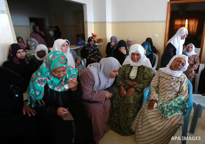 Relatives of Palestinian youth Yousef Abu Zagha, 20, mourn during his funeral at the morgue of the Jenin refugee camp, in Jenin, West Bank, 01 July 2014. Media reports citing locals and medics reports state the Israeli f...