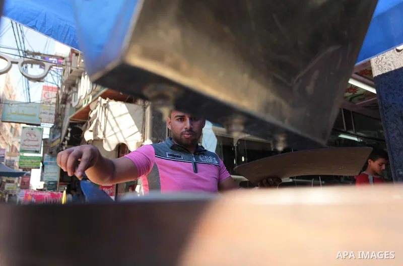 A Palestinian vendor prepares traditional pancakes known as ''Qatayef'' during the holy fasting month of Ramadan in Gaza city, on July 01, 2014. Muslims around the world refrain from eating, drinking and sexual intercour...