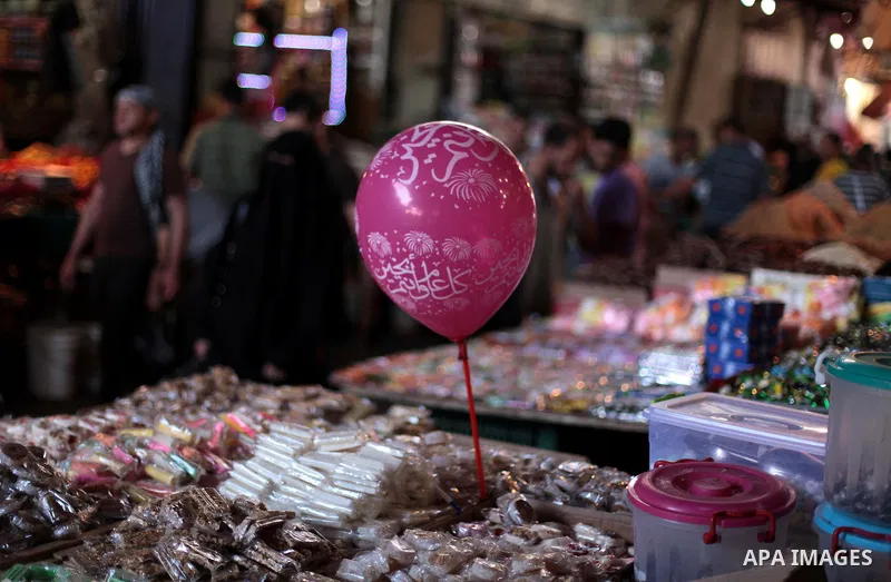 Palestinians shop at a market during the holy fasting month of Ramadan in Gaza city, on July 01, 2014. Muslims around the world refrain from eating, drinking and sexual intercourse from dawn till dusk during Ramadan, the...