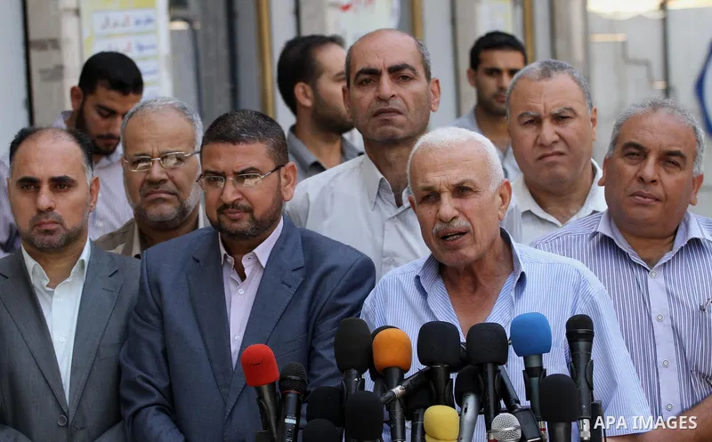 Members of Palestinian factions speak during a press conference in Gaza city on July 03, 2014. Photo by Mohammed Asad