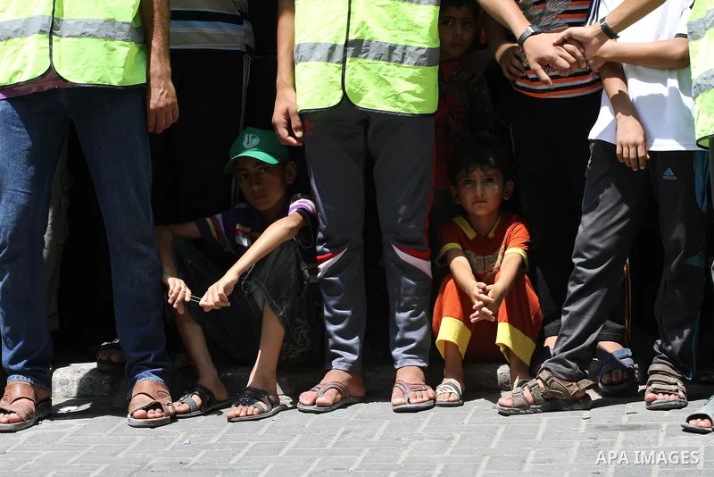 Palestinian supporters of Hamas movement take part in a rally in solidarity with the Palestinian in the West Bank and against any possible Israeli attack on Gaza, in Jabalia in the northern Gaza Strip, July 04, 2014. The...