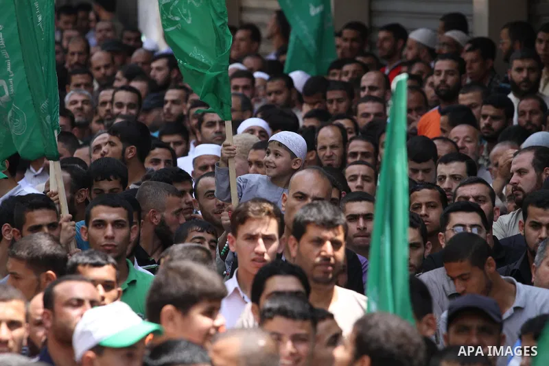 Palestinian supporters of Hamas movement take part in a rally in solidarity with the Palestinian in the West Bank and against any possible Israeli attack on Gaza, in Jabalia in the northern Gaza Strip, July 04, 2014. The...