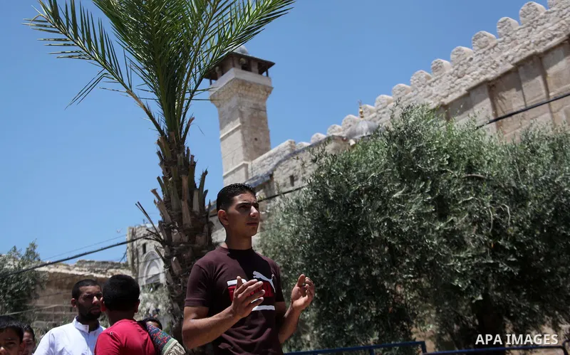 Palestinian muslims attend Friday prayers, the first of Islam's holy month of Ramadan, at Ibrahimi mosque "Sanctuary of Abraham", in the West Bank City of Hebron July 04, 2014. Photo by Mamoun Wazwaz