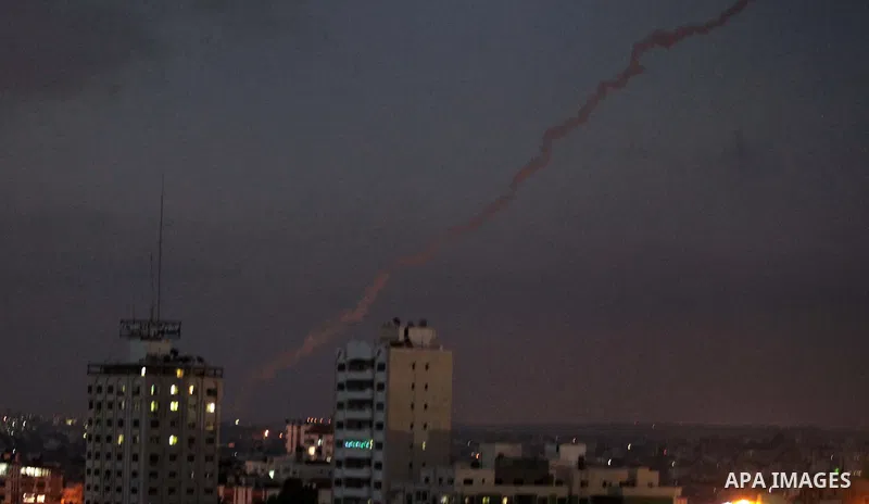 Smoke trails are seen as two rockets are launched from the east Gaza City towards Israel on July 07, 2014. Israeli air strikes on Gaza, that killed at least seven Palestinian militants overnight, came after a day in whic...