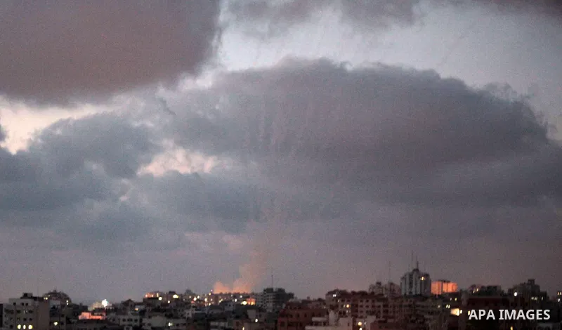 Smoke trails are seen as two rockets are launched from the east Gaza City towards Israel on July 07, 2014. Israeli air strikes on Gaza, that killed at least seven Palestinian militants overnight, came after a day in whic...