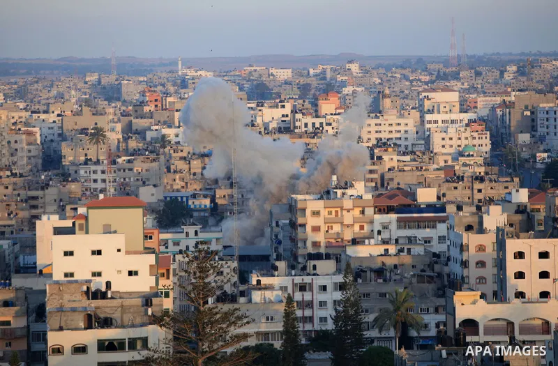 Smoke billows from buildings following an Israeli air strike in Gaza City on July 11, 2014. Israel's aerial bombardment of Gaza claimed its 105th Palestinian life as Hamas pounded central Israel with rockets and Washingt...
