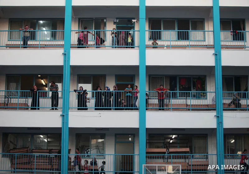 Palestinians take shelter at the United Nations school after they fled their homes in Gaza City on Sunday, July 13, 2014. Israel briefly deployed ground troops inside the Gaza Strip for the first time early Sunday as its...
