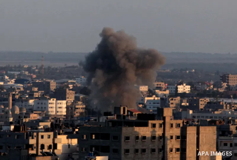 Smoke billows from a building hit by an Israeli air strike in Gaza City, on July 14, 2014. Washington warned its Israeli ally today against any ground invasion of Gaza, as Egyptian officials said the US top diplomat was...