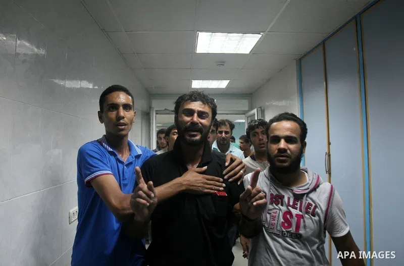 Relatives mourn the death of one Palestinian children from the Baker family, who was Injury by a shell fired by an Israeli naval gunboat, at the beach in Gaza Strip on July 16, 2014, Gaza City on July 22, 2014. Israel ke...