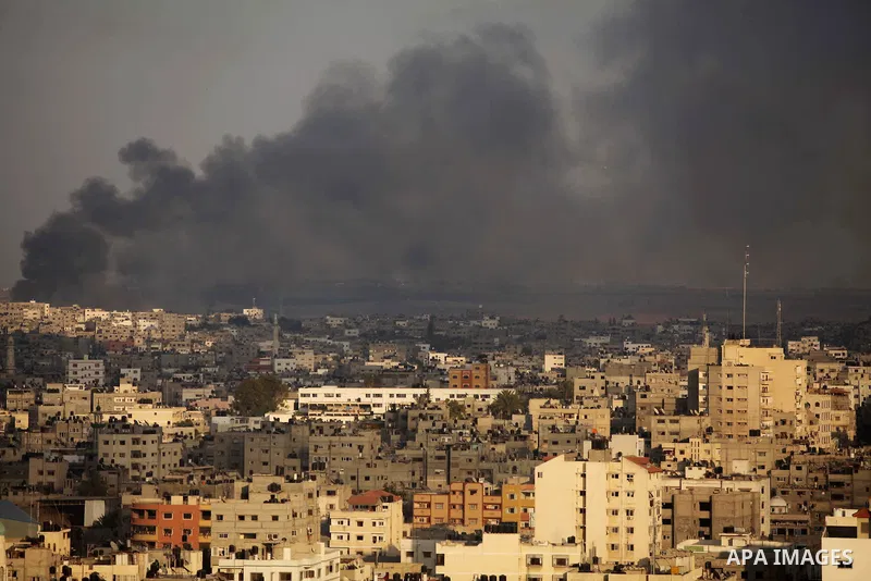 Smoke rises from buildings following an Israeli airstrike in eastern Gaze City neighbourhood of Shejaiya during a military operation on July 23, 2014. A series of strikes and shellings throughout Gaza brought the total n...