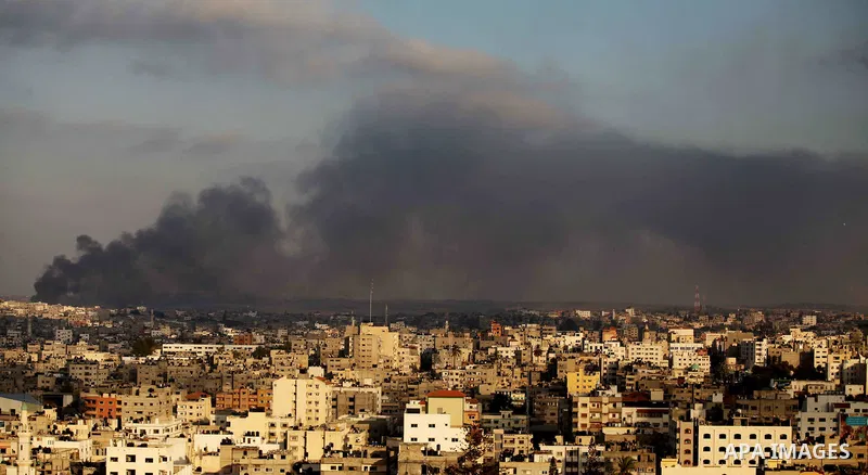 Smoke rises from buildings following an Israeli airstrike in eastern Gaze City neighbourhood of Shejaiya during a military operation on July 23, 2014. A series of strikes and shellings throughout Gaza brought the total n...