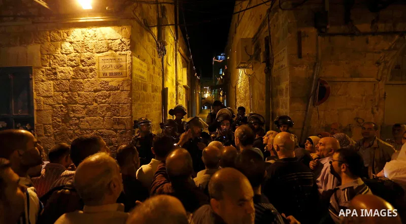 Israeli policemen stand guard as they barring entrance to the al-Aqsa mosque to men younger than 50 years, to mark Laylat al-Qadr, or Night of Destiny, in Jerusalem's Old City on July 24, 2014. On Friday, dozens of Pales...