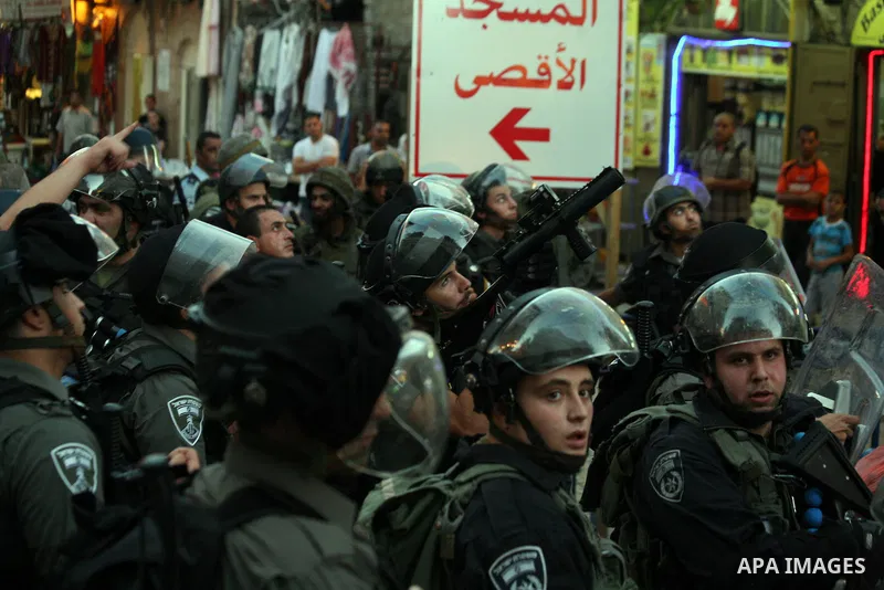 Israeli policemen stand guard as they barring entrance to the al-Aqsa mosque to men younger than 50 years, to mark Laylat al-Qadr, or Night of Destiny, in Jerusalem's Old City on July 24, 2014. On Friday, dozens of Pales...