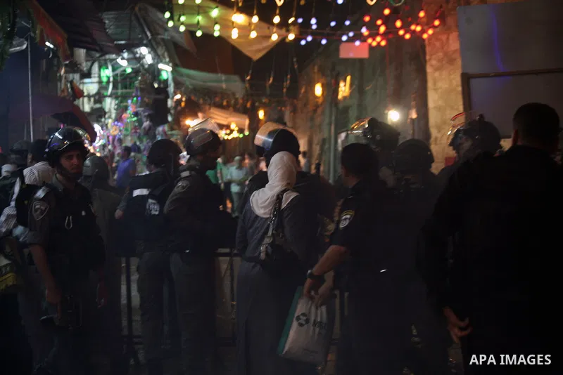 Israeli policemen stand guard as they barring entrance to the al-Aqsa mosque to men younger than 50 years, to mark Laylat al-Qadr, or Night of Destiny, in Jerusalem's Old City on July 24, 2014. On Friday, dozens of Pales...