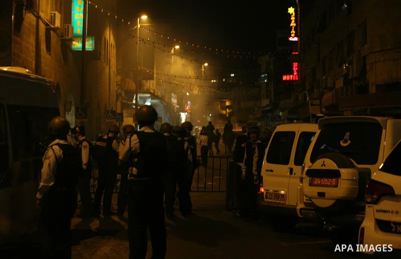 Israeli policemen stand guard as they barring entrance to the al-Aqsa mosque to men younger than 50 years, to mark Laylat al-Qadr, or Night of Destiny, in Jerusalem's Old City on July 24, 2014. On Friday, dozens of Pales...