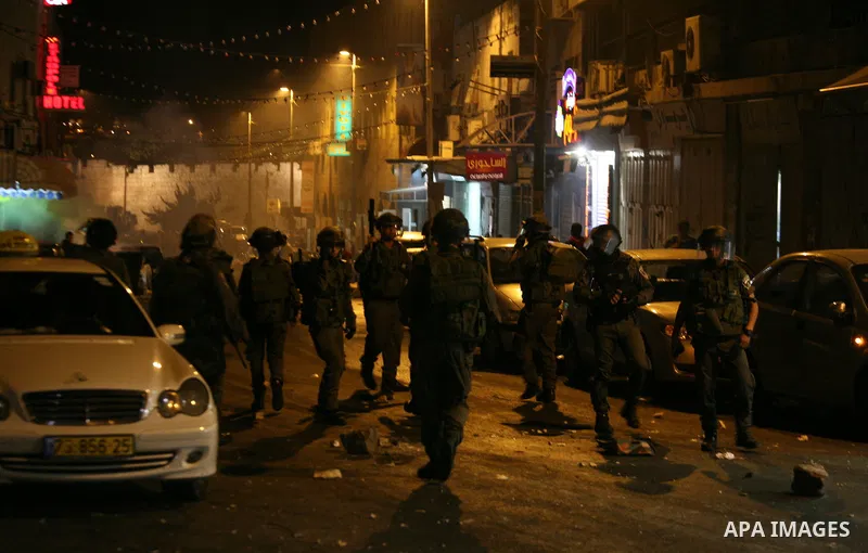 Israeli policemen stand guard as they barring entrance to the al-Aqsa mosque to men younger than 50 years, to mark Laylat al-Qadr, or Night of Destiny, in Jerusalem's Old City on July 24, 2014. On Friday, dozens of Pales...