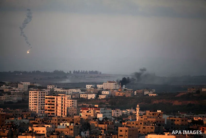 Smoke billows from a building hit by an Israeli air strike in Gaza City on July 25, 2014. Israel rejected a Gaza ceasefire proposal presented by US Secretary of State John Kerry, Israeli public television reported.. Phot...