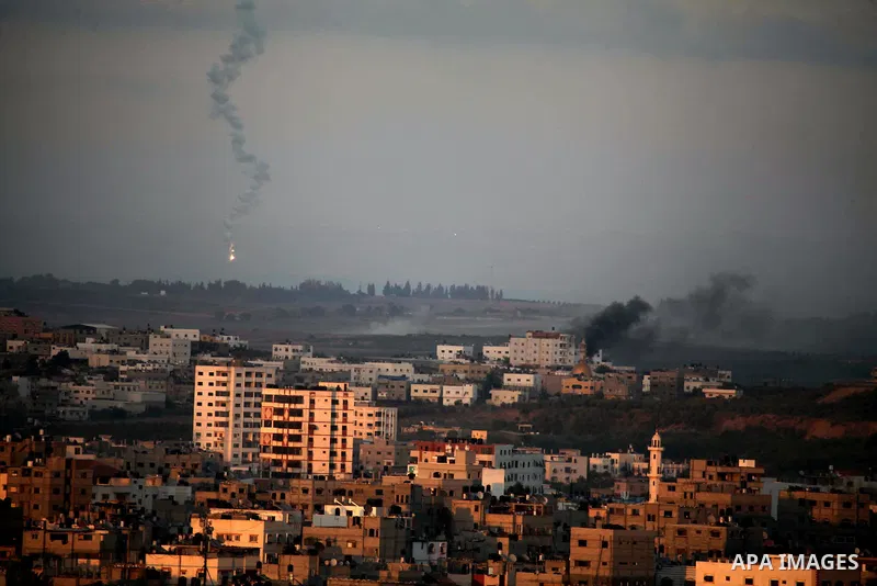 Smoke billows from a building hit by an Israeli air strike in Gaza City on July 25, 2014. Israel rejected a Gaza ceasefire proposal presented by US Secretary of State John Kerry, Israeli public television reported.. Phot...